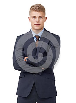 Young and determined. An ambitious young businessman crossing his arms on a white background.