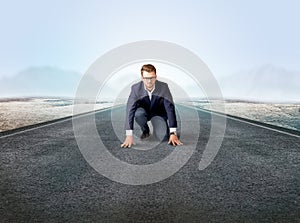 Businessman kneeling in ready position