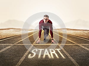 Businessman kneeling in ready position