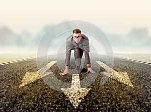 Businessman kneeling in ready position