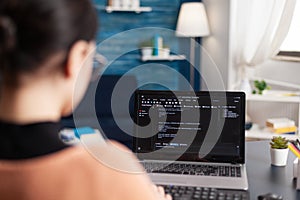 Young developer programming software typing html code