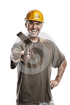 Young dirty Worker Man With Hard Hat helmet holding a hammer