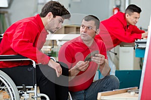 young disabled apprentice in workshop