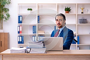 Young disabled employee working in the office