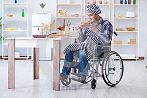 The young disabled husband preparing food salad