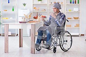 The young disabled husband preparing food salad