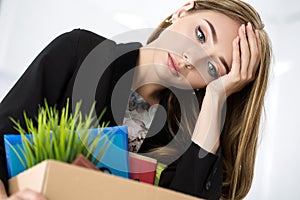 Young dismissed female worker portrait