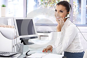 Young dispatcher working in bright office smiling photo