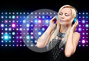 Young DJ Woman with Headphones. Happy Blonde Girl