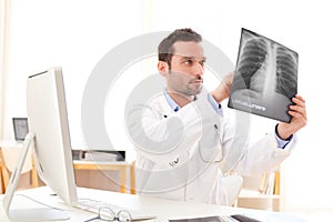 young doctor analysing a radiography