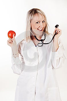 Young doctor with apple and stethoscope