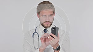 Young Doctor Browsing Smartphone on White Background