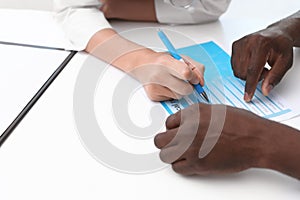 Young doctor consulting African-American patient