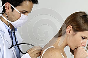 Young doctor examining his patient