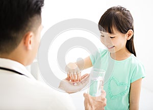 Young doctor gives the child medicine