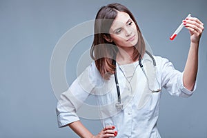 Young doctor holding coronavirus vaccine