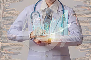 Young doctor holding smart watch and touching visual screen of medical stock