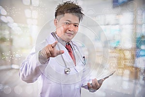 The young doctor intends to work in the back room Doctor hand working smart phone modern digital tablet laptop computer graphics c