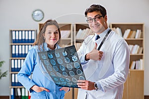 The young doctor looking at computer tomography x-ray image