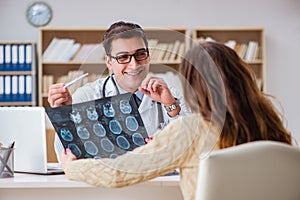 The young doctor looking at computer tomography x-ray image