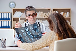 The young doctor looking at computer tomography x-ray image