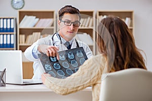 The young doctor looking at computer tomography x-ray image