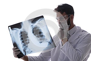 The young doctor looking at x-ray images isolated on white