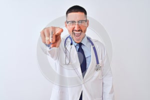 Young doctor man wearing stethoscope over isolated background pointing displeased and frustrated to the camera, angry and furious