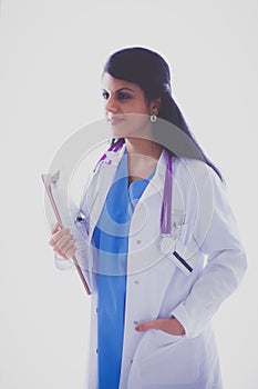 Young doctor or medic with clipboard and stethoscope standing on white background