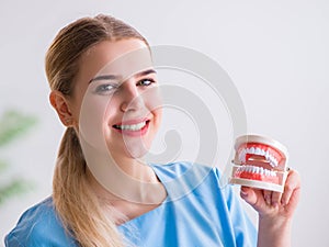 Young doctor nurse with dentures