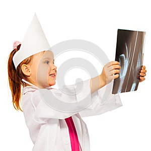 Young doctor radiologist studying an x-ray