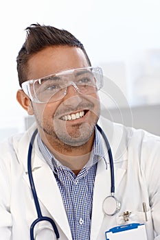 Young doctor in safety googles