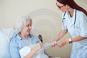 Young doctor with senior patient