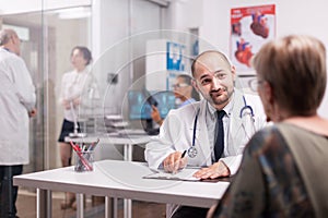 Young doctor and senior patient