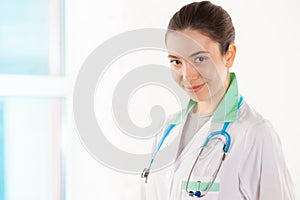 Young doctor with stethoscope on her neck