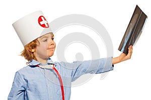 Young doctor studying an x-ray of hand