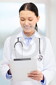 Young doctor with tablet pc and sthethoscope