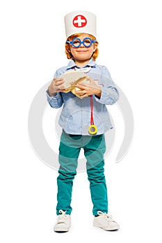 Young doctor in toy glasses with cerebrum dummy