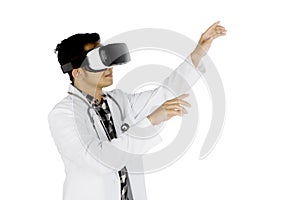 Young doctor using a virtual reality goggles
