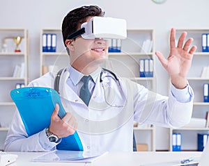Young doctor with vr virtual reality headset working in the offi