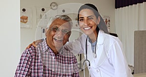 Young doctor woman and elderly patient man posing for portrait