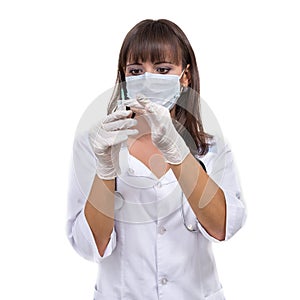 Young doctor woman with syringe against white background