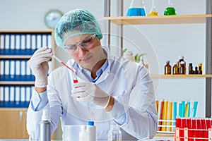 The young doctor working on blood test in lab hospital