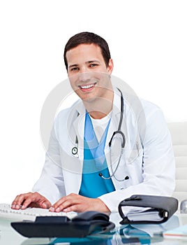 Young doctor working at a computer