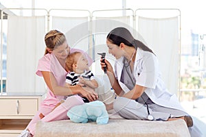 Young doctors attending to a baby