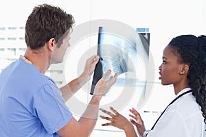 Young doctors looking at a of X-ray