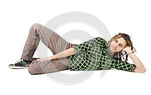 Young dreadlock man lies isolated