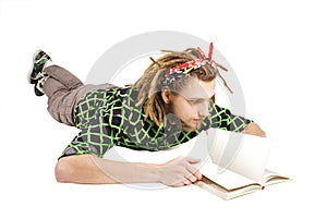 Young dreadlock man reading book isolated