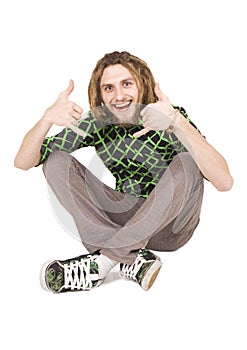 Young dreadlock man sits isolated