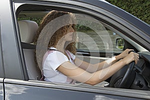 Young driver with a good posture for driving